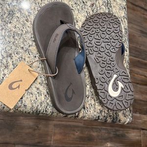 OluKai men’s dark brown flip flops